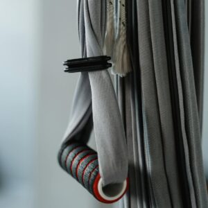 Gray aerial yoga equipment with handlebar, ideal for exercise setups.